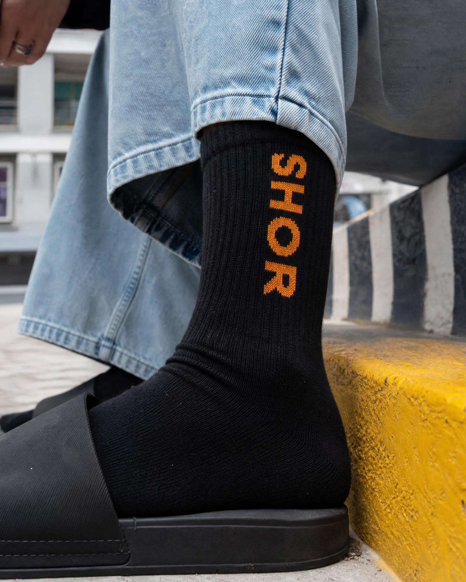 "SHOR" Ribbed Crew Sock — Ink/Marigold — on model